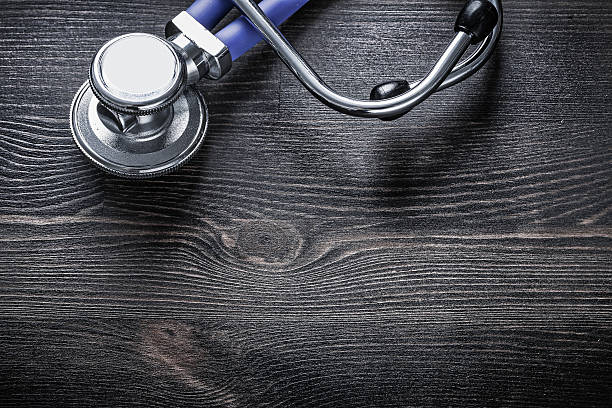 istock New medical stethoscope on wooden board horizontal image medicin 500627200
