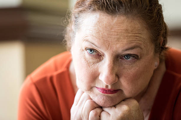 istock Pensive mature woman looking away 500638692