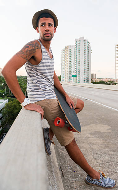 istock Miami Man With Skateboard Stands Along Urban Road 500638892