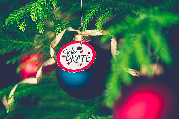 istock Christmas bauble with Celebrate message on Christmas tree branches 500639106