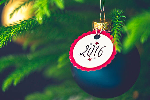 istock Christmas bauble with New Year message on Christmas tree branches 500639150