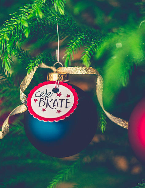 istock Christmas bauble with Celebrate message on Christmas tree branches 500640130