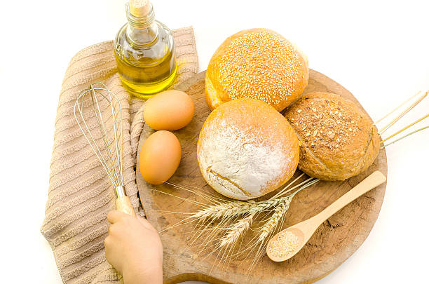 istock fresh bread and wheat on the wooden 500640132