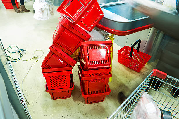 istock Red plastic supermarket shopping baskets 500642984