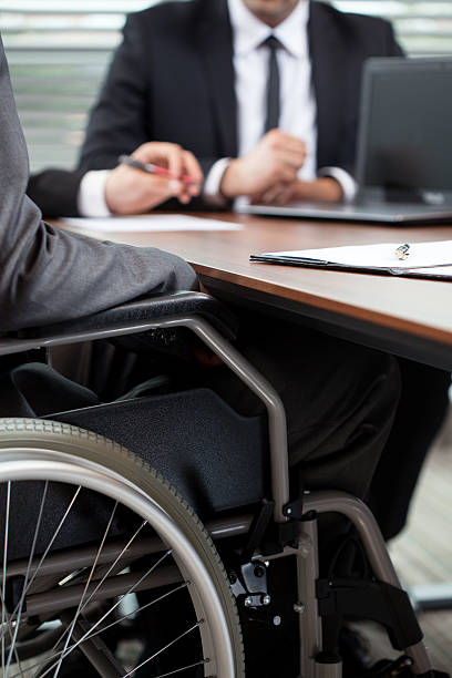 istock Man on wheelchair during conversation 500645267