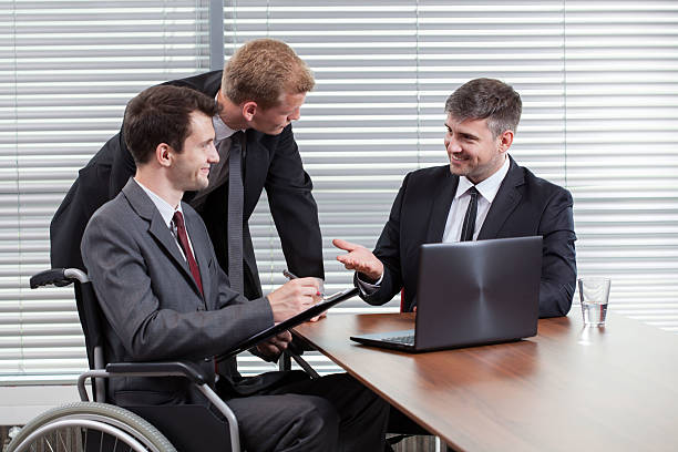 istock Happy disabled man during business meeting 500645273