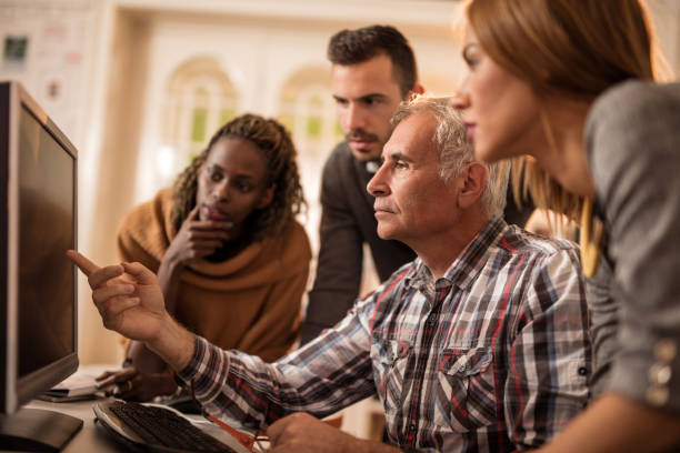 istock Team of casual business people working on desktop PC. 500646356