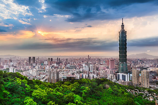 Taipei City View at Evening Bright cloudy sky at an spring evening with sunshine rays and wide cityscape of Taipei, Taiwan taipei photos stock pictures, royalty-free photos & images