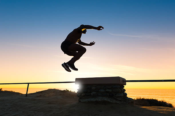 istock Man Box Jumping During Sunset at the Ocean 500648388