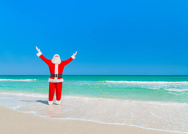 istock Santa Claus sunbathing and enjoy sun at tropical sandy beach 500648886