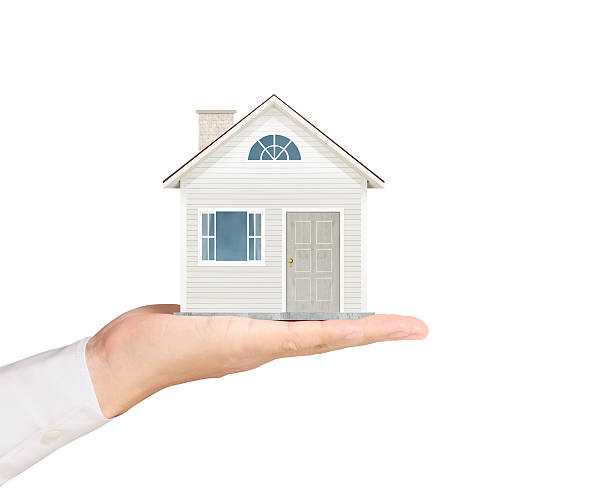 istock holding house representing home ownership 500649722