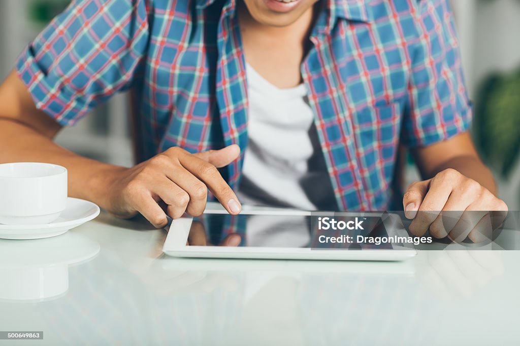 Digital tablet Close-up of student using a digital tablet Adult Stock Photo