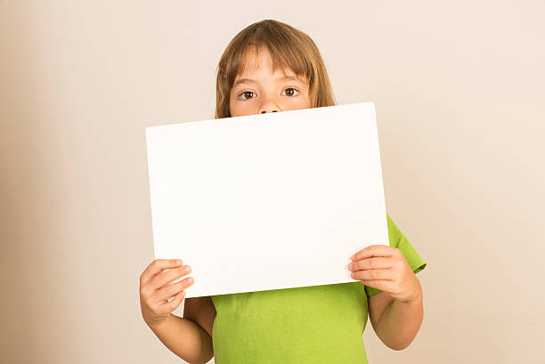 istock Little girl carrying a poster 500649889
