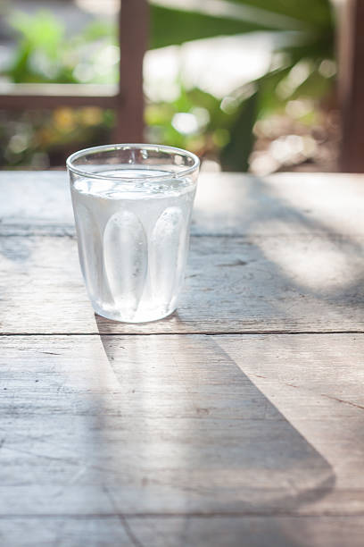 istock Glass of cold water on wooden table 500652096