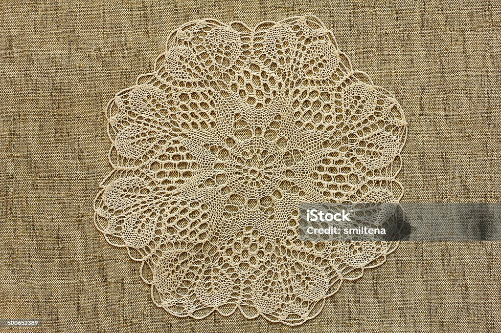 Burlap with openwork doily Backgrounds Stock Photo