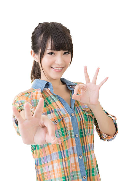 istock Young asian woman showing OK gesture 500652647