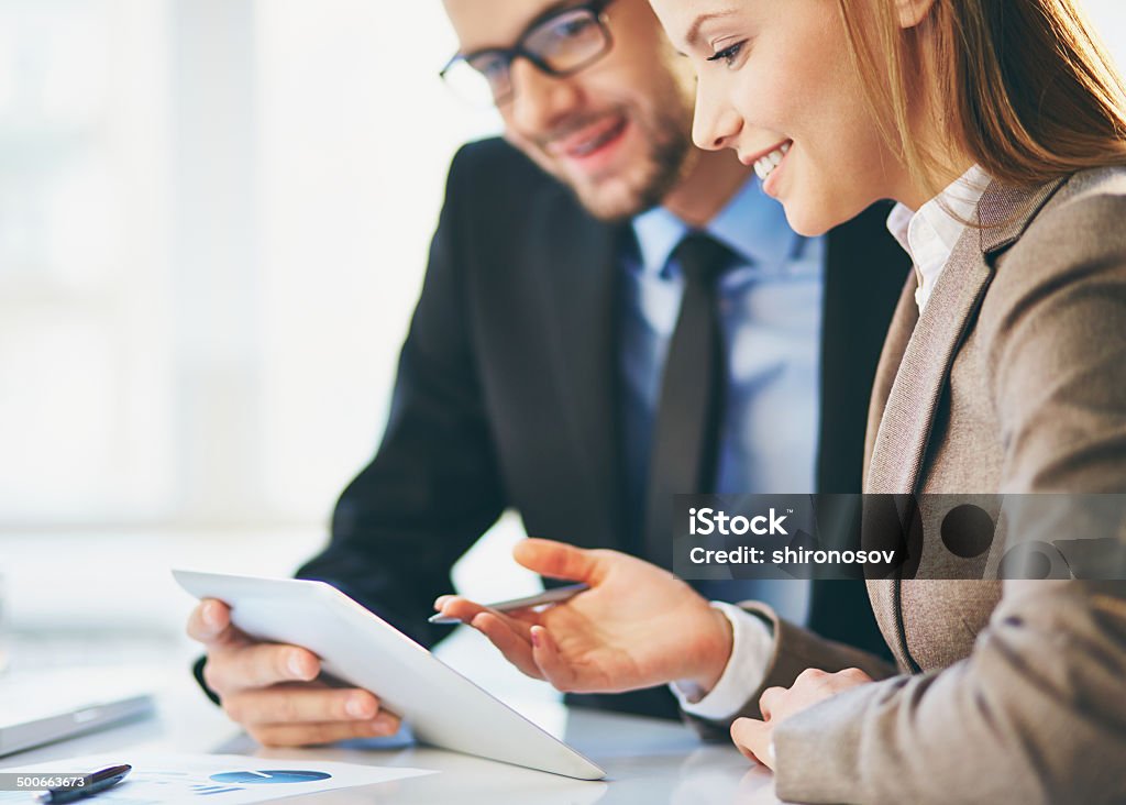 Explanation Young businesswoman explaining report to her colleague at meeting Business Meeting Stock Photo