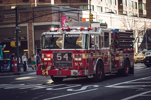 New York City, United States of America - September 14, 2015 , Fire department in Mission on Manhattan streets on 14 September 2015. FDNY establish in july 31 , 1648 has 10 divisions and answer for almost half a million annual calls
