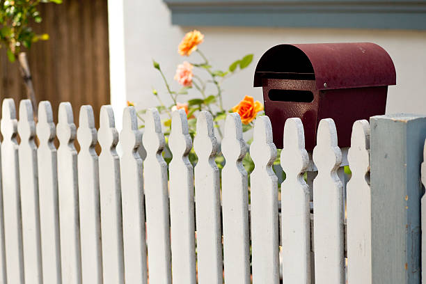 istock Letter box behind picket fence 500664822