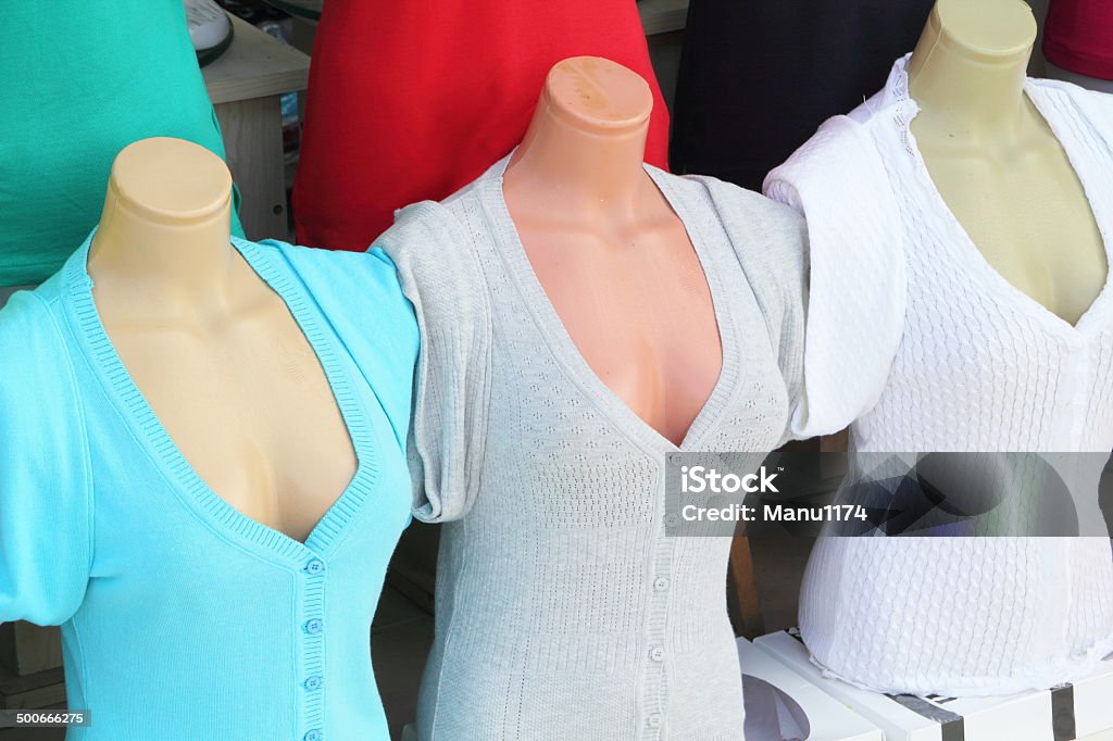 Fashion store mannequins colorful pullovers in a store Adult Stock Photo