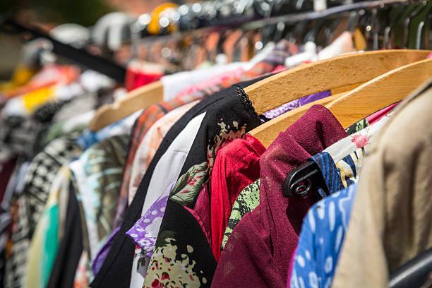 istock clothes on a rack on a flea market 500666617