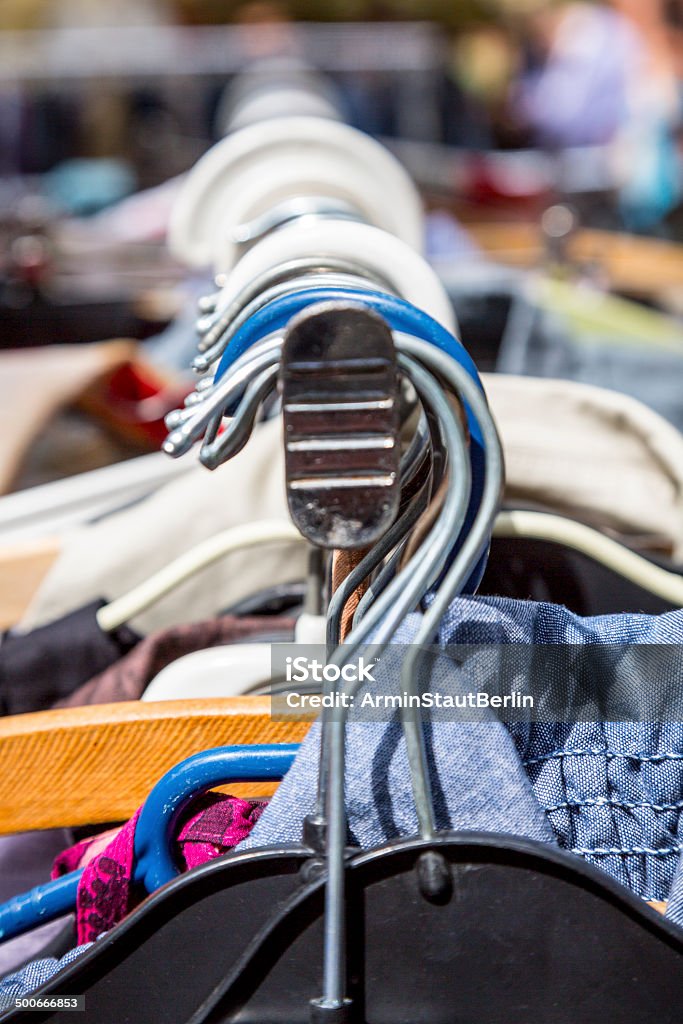 clothes on a rack on a flea market clothes on a rack on a flea market. Abundance Stock Photo