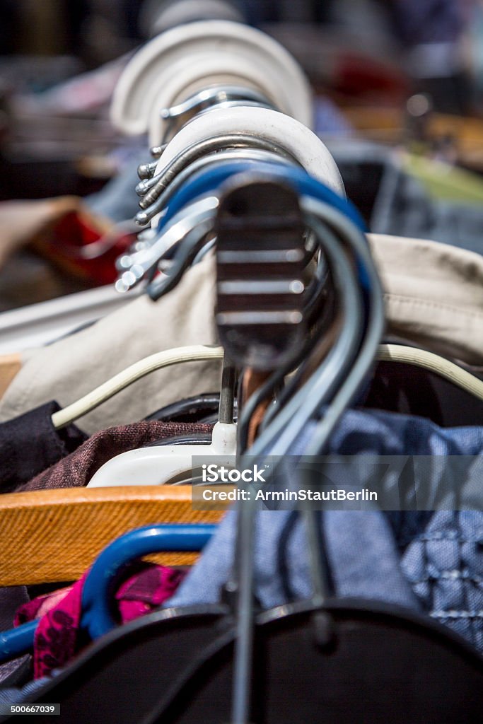 clothes on a rack on a flea market clothes on a rack on a flea market. Abundance Stock Photo