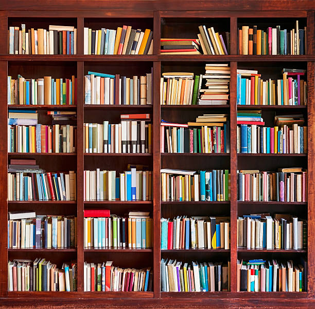 Bookshelf Messy bookshelf filled with old books bookshelf stock pictures, royalty-free photos & images