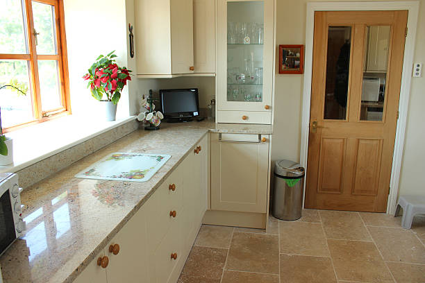 istock Country kitchen with pine door, Shaker cabinets, granite worktop, tiles 500668471