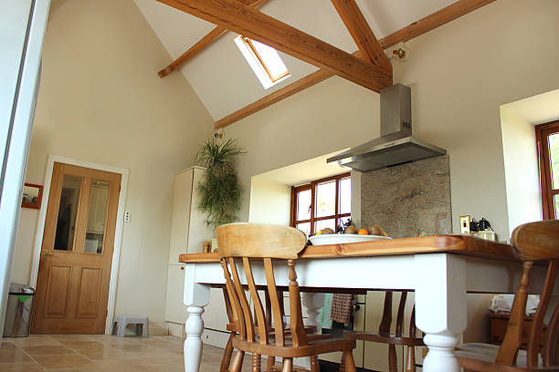 istock Country kitchen, granite worktop, gas range cooker, tiled floor, pine-table 500668511