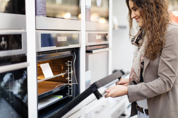 Woman buying stove