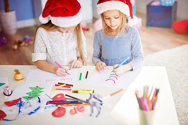 istock Best friends making some christmas ornaments 500668662