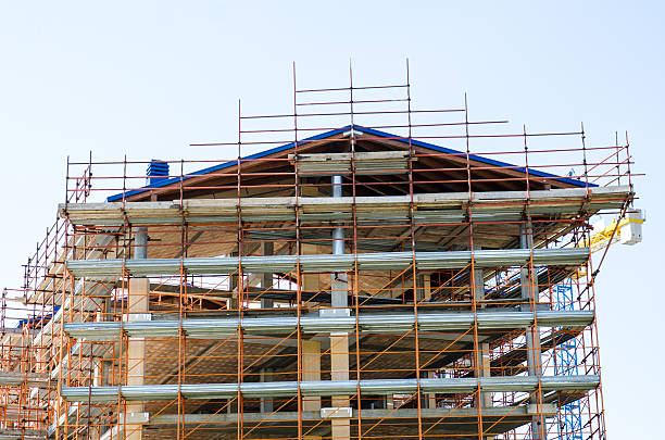 istock House exterior in construction and crane 500668739