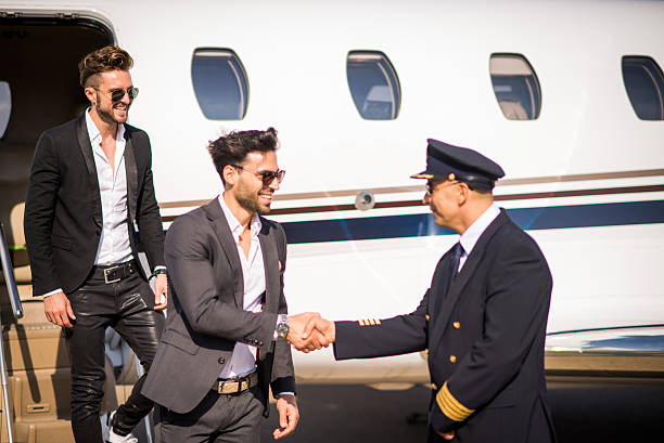 istock Rich men leaving private jet airplane 500668904