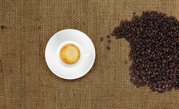 istock cup of coffee with coffee beans on jute fabric 500669389
