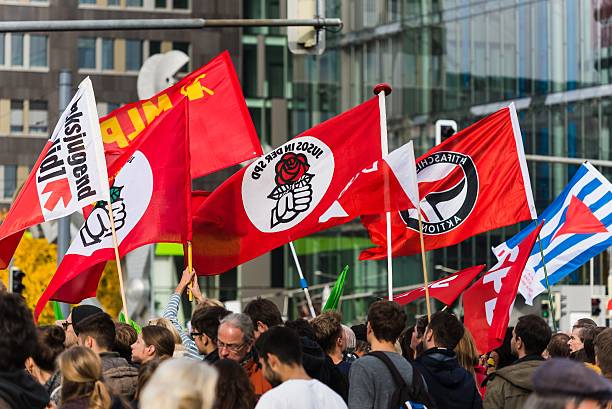 Counterdemonstration against radicals of the right wing Heidelberg, Germany - October 24, 2015: Counterdemonstration against radicals of the right wing 'Steh auf für Deutschland' in Heidelberg. More than 900 people demonstrated against the 40 hooligans. national democratic party of germany stock pictures, royalty-free photos & images