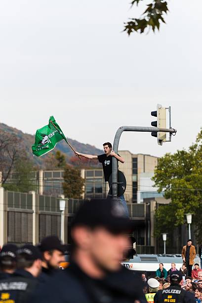 Counterdemonstration against radicals of the right wing Heidelberg, Germany - October 24, 2015: Counterdemonstration against radicals of the right wing 'Steh auf für Deutschland' in Heidelberg. More than 900 people demonstrated against the 40 hooligans. national democratic party of germany stock pictures, royalty-free photos & images