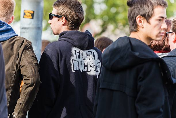 Counterdemonstration against radicals of the right wing Heidelberg, Germany - October 24, 2015: Counterdemonstration against radicals of the right wing 'Steh auf für Deutschland' in Heidelberg. More than 900 people demonstrated against the 40 hooligans. national democratic party of germany stock pictures, royalty-free photos & images