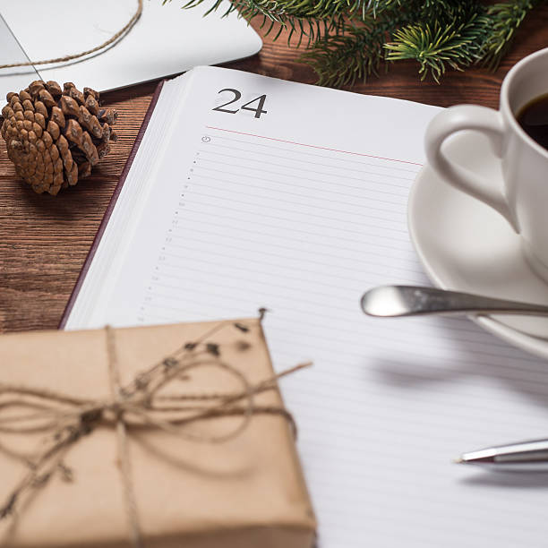 istock Cup of coffee with notebook and gifts 500672260