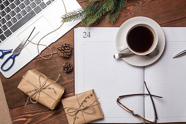 istock Cup of coffee with notebook and gifts 500672344