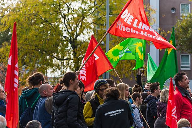 Counterdemonstration against radicals of the right wing Heidelberg, Germany - October 24, 2015: Counterdemonstration against radicals of the right wing 'Steh auf für Deutschland' in Heidelberg. More than 900 people demonstrated against the 40 hooligans. national democratic party of germany stock pictures, royalty-free photos & images