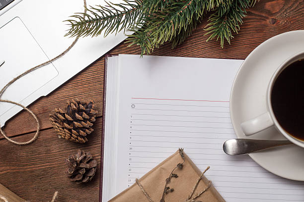 istock Cup of coffee with notebook and gifts 500672388