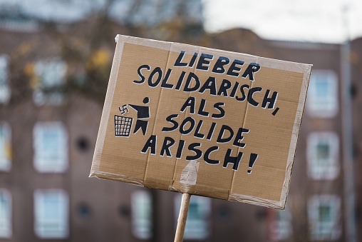 Heidelberg, Germany - October 24, 2015: Counterdemonstration against radicals of the right wing 'Steh auf für Deutschland' in Heidelberg. More than 900 people demonstrated against the 40 hooligans.