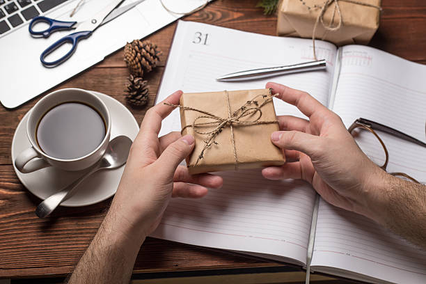 istock White man holding New Year gift 500673724