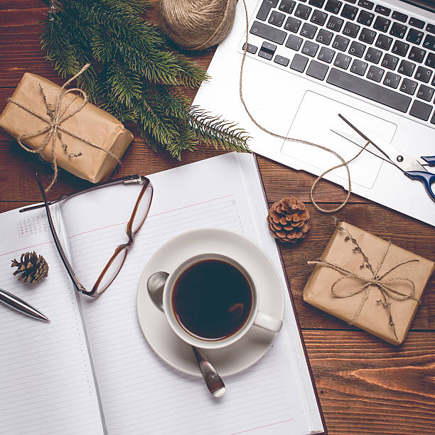 istock Cup of coffee with notebook and gifts 500674128