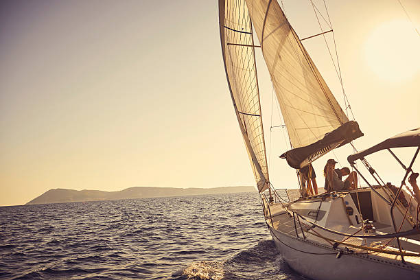 shot of a young couple spending time together on a yacht - on a yacht bildbanksfoton och bilder