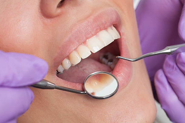 istock Dentist working on girls teeth 500676968