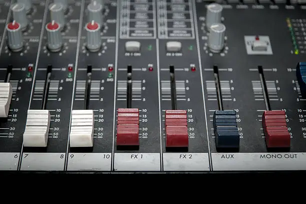 Photo of Sound mixer control panel, close-up of audio controls