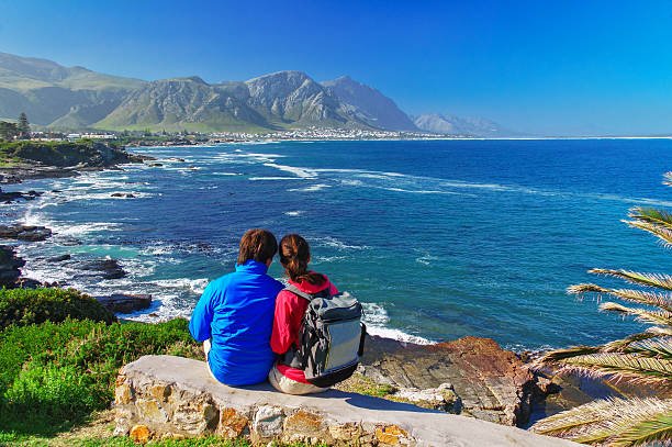 Happy couple looking at beautiful ocean view