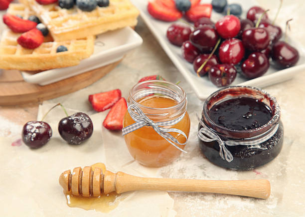 cherry jam and honey stock photo